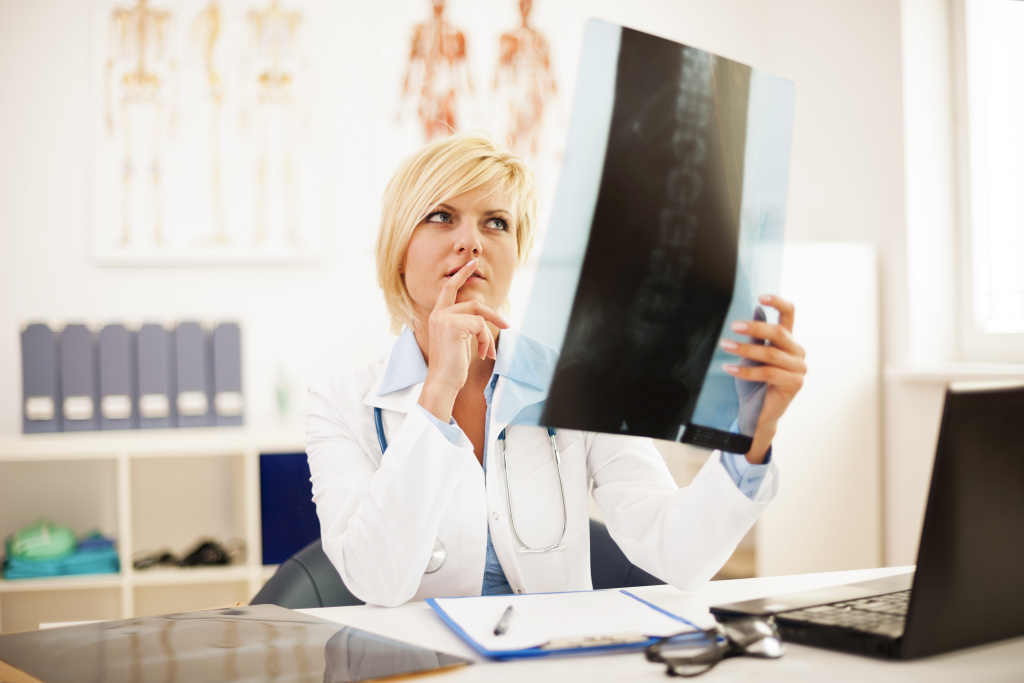 female-doctor-studying-spine-x-ray.jpg